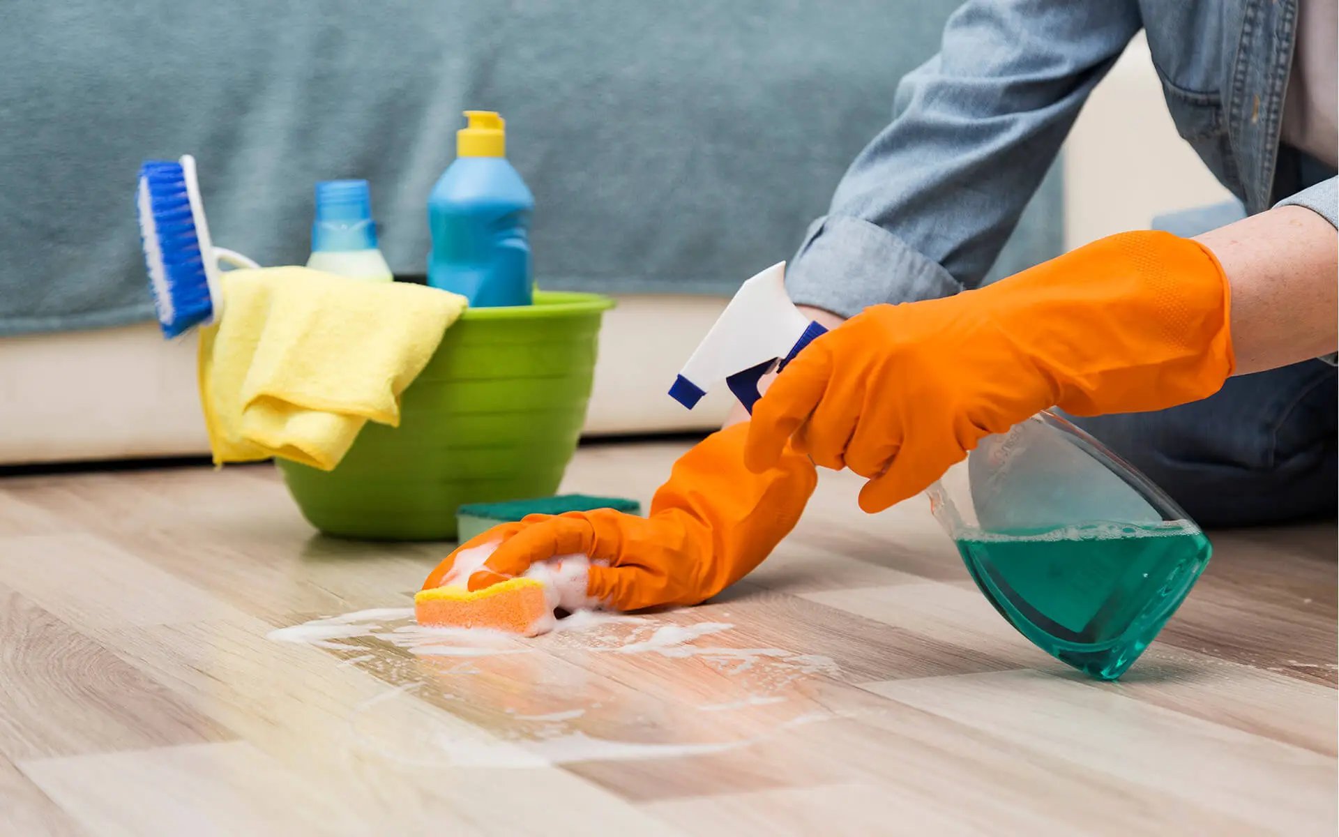 Cleaner scrubbing a floor during a deep clean